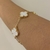 PULSEIRA TREVO MADREPEROLA DOURADO - comprar online