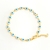 Pulsera con eslabones ojo blanco con azul 18 k premium