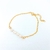 Pulsera con perlas de rio y baño de oro 14 k