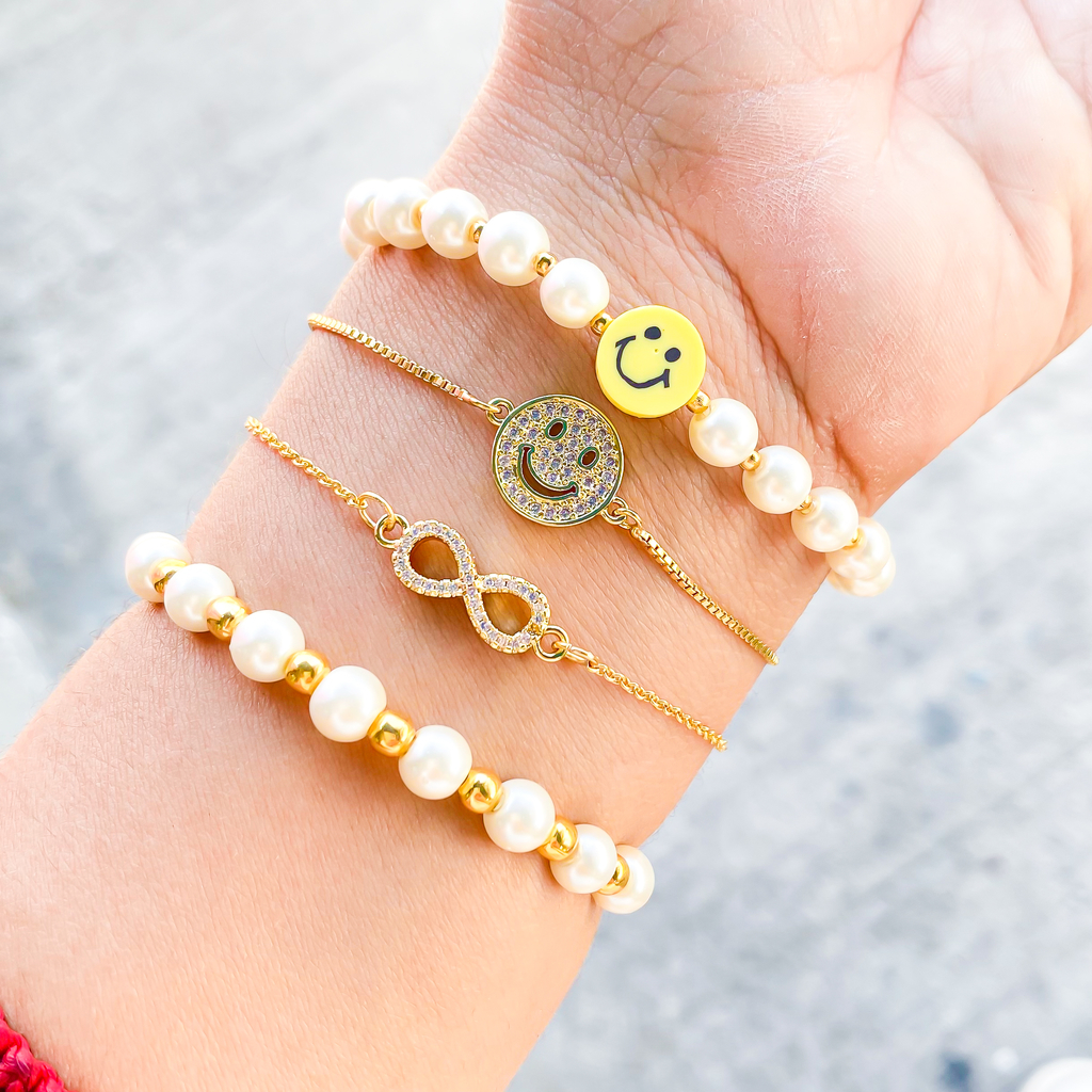 Pulsera carita feliz con perlas y bolas de chapa de oro 18 k