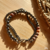 Pulseira Boho, Mola níquel. Correntes grafite. Entremeios grafite. Pedras hematita e jaspe leopardo. Fecho lagosta. Extensor. Peso: 18 g. Tamanho: 6 cm de diâmetro.