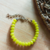 Pulseira boho com Cristais de vidro amarelo. Corrente níquel envernizado. Fecho lagosta. Peso: 12 g. Tamanho: 16,5 cm.