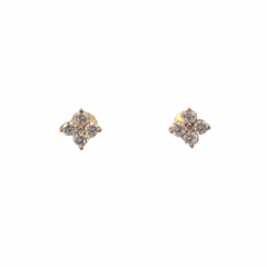 Rosette earrings in 18 kt gold and white sapphires