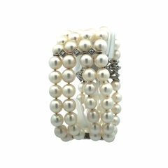 18 kt gold and diamond natural pearl bracelet. on internet