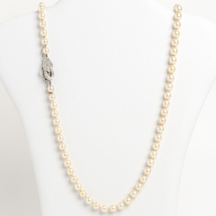 Natural pearl necklace with platinum clasp and diamonds