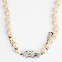 Natural pearl necklace with platinum clasp and diamonds - buy online