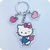 Hello Kitty Core com pingente maçã e coração