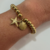 PULSEIRA BOLINHAS COM PINGENTE BANHADO A OURO 18K na internet