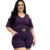 Macaquinho feminino plus size roxo com mangas soltas e cinto dourado na cintura.