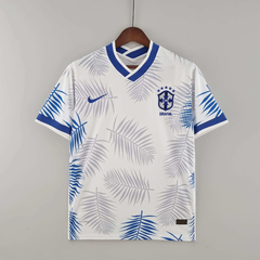 camisa-seleção-brasileira-nova-branca-concept-edicao-especial-folhas-22/23-branco-nike-azul