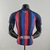 Camisa Barcelona 22/23 Jogador Nike Masculina - Azul e Grená - comprar online