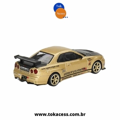 Miniatura 1:64 MINI GT - Nissan Skyline GT-R (R34) Top Secret Gold - #676 na internet