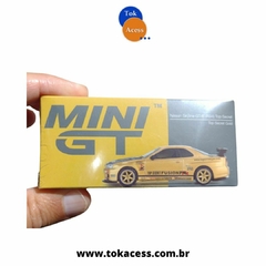 Miniatura 1:64 MINI GT - Nissan Skyline GT-R (R34) Top Secret Gold - #676