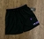 Bermuda cargo Nike “preta com roxo”