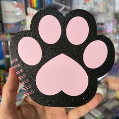 LIBRETA EN FORMA DE GARRA DE GATITO CON DETALLES DE GLITTER ARILLOS COLOR NEGRO Y ROSA HOJAS BLANCAS LIBRETAS