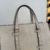 Bolsa Gucci GG Embossed Tote Bag Off-White