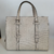 Bolsa Gucci GG Embossed Tote Bag Off-White na internet