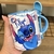 Caneca com Colher Personalizada Stitch Ele e Ela com Nome