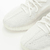 Explore o estilo icônico da linha do Kanye West com o Adidas Yeezy 350 v2 Bone, um tênis unissex em branco puro. Com material de tecido e tecnologia de amortecimento boost para conforto, este é um produto original da sneakersjc. Perfeito para um estilo ca