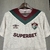 Camisa Fluminense III 24/25 Torcedor Umbro Masculina na cor bege, com detalhes em verde e bordô, destacando o logo do clube e a marca Umbro. camisa-camisas-blusa-blusas-uniforme-fluminense-iii-3-terceira-terceiro-24-25-torcedor-umbro-masculina-masculino-b