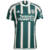 Camisa do Manchester United Away nas Cores Verde e Branca com listras nas verticais. Seu escudo em borado ao lado esquerdo do peito no lado direito fica a logo da Adidas em branca sua gola redonda na cor Branca nos ombros segue as 3 listras em branca marc