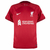 Camisa do Liverpool da temporada 2022/23 na cor Vermelha com predominante, sua Gola redonda  e seu escudo bordado no lado esquerdo do peito enquanto a logo da Nike fica ao lado direito do peito.