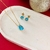 CONJUNTO DE PEDRA GOTA AZUL BANHADO A OURO 18K