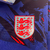 jaqueta-blusa-corta-vento-lançamento-barato-replica-dupla-face-inglaterra-nike-azul-2024-seleção-10.webp