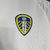 camisa-camisas-camisetas-manto-mantos-blusa-blusas-roupa-roupas-uniforme-leeds-united-primeira-titular-home-i-fan-tailandesas-replica-original-2024-2025-24-25-torcedor-masculina-masculino-branca-branco-7.webp