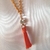 Colar de Tassel Laranja com Ponto de Luz - comprar online