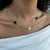 Choker Trevos Dourados e Pedras Pretas Banhado a Ouro 18K