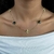 Choker Trevos Dourados e Pedras Pretas Banhado a Ouro 18K - loja online