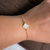 Pulseira Trevo Branco Perolado Banhado a Ouro 18k