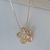 Colar Flor com Ponto de Luz Banhado a Ouro 18k - comprar online