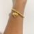 Pulseira de bolinhas com pingente de coração folheado a ouro 18k