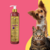 Frasco de Shampoo Clareador Tonalizante Ametista Cereja e Avelã da Dolce Pet, com um cachorro e um gato ao fundo.