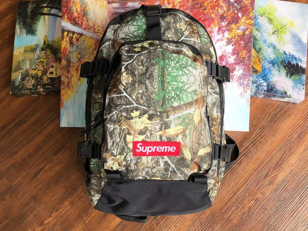 Master Urban Style with the Supreme Backpack Real Tree Camo - Black
