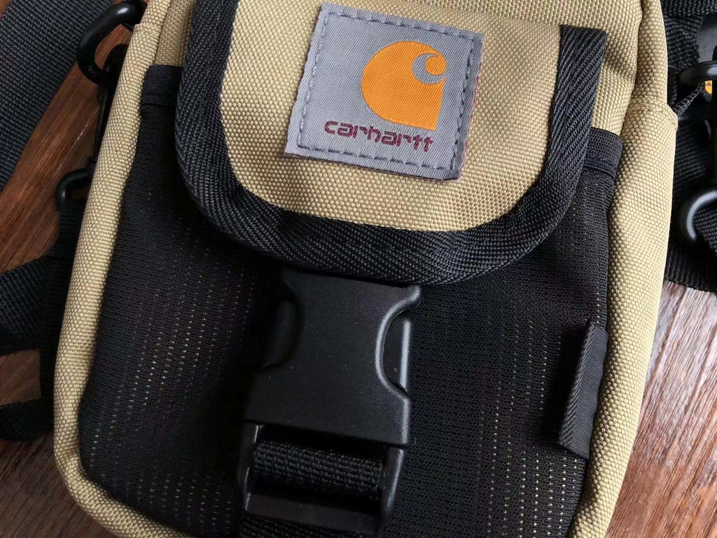Buy the Carhartt Wip Delta Shoulder Pouch in Safety Orange