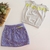 Conjunto Blusa em Meia Malha e Short-Saia em Moletinho