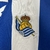 camisa-real-sociedad-home-titular-i-1-azul-royal-branca-24-25-macron-torcedor-unissex-gola-polo-yasuda-group-kutxabank-kit-infantil-short-branco-3.jpg