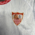 camisa-sevilla-home-titular-i-1-branco-cinza-claro-vermelho-24-25-castore-torcedor-masculina-gola-redonda-degiro-valvoline-4.jpg