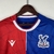 camisa-crystal-palace-home-i-1-vermelha-azul-branca-23-24-macron-torcedor-masculino-cinch-gola-redonda-3.jpg