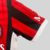 camisa-ac-milan-home-titular-i-1-vermelho-preto-branco-24-25-puma-torcedor-unissex-gola-redonda-emirates-fly-better-msc-kit-infantil-short-branco-5.jpg