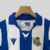 camisa-real-sociedad-home-titular-i-1-azul-royal-branca-24-25-macron-torcedor-unissex-gola-polo-yasuda-group-kutxabank-kit-infantil-short-branco-2.jpg