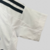 camisa-real-madrid-home-titular-i-1-branca-preta-24-25-adidas-torcedor-masculina-gola-v-emirates-fly-better-hp-kit-infantil-short-branco-5.jpg