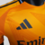 camisa-real-madrid-away-reserva-ii-2-laranja-azul-marinho-24-25-adidas-jogador-masculina-gola-redonda-emirates-fly-better-7.jpg