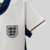 camisa-selecao-inglaterra-home-titular-i-1-branca-azul-escuro-vermelho-24-25-nike-torcedor-feminino-gola-mini-polo-7.jpg