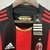 1. Camisa oficial do Milan, 2. Design retro inspirado na temporada 10/11, 3. Para torcedores apaixonados, 4. Cores tradicionais vermelho e preto, 5. Confeccionada em material de qualidade, 6. Perfeita para jogos e eventos, 7. Tamanho masculino, 8. Estampa