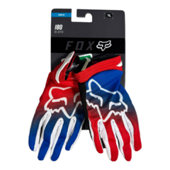 Guantes Fox 180 Toxsyk para niños, en colores rojo y azul, con diseño gráfico y etiqueta de tamaño juvenil.