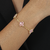 Pulseira Dourada Trevos Zircônia Rosa - comprar online